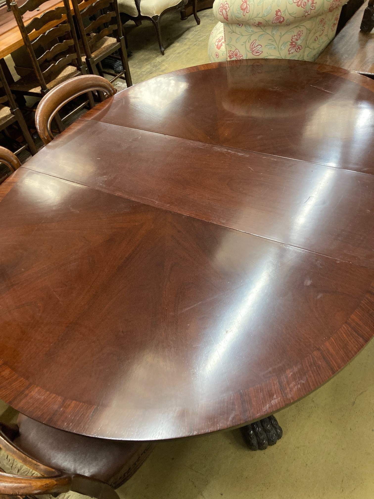 A large reproduction mahogany extending dining table, 174cm extended, width 138cm, height 77cm